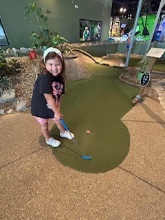lucy golfing.JPG