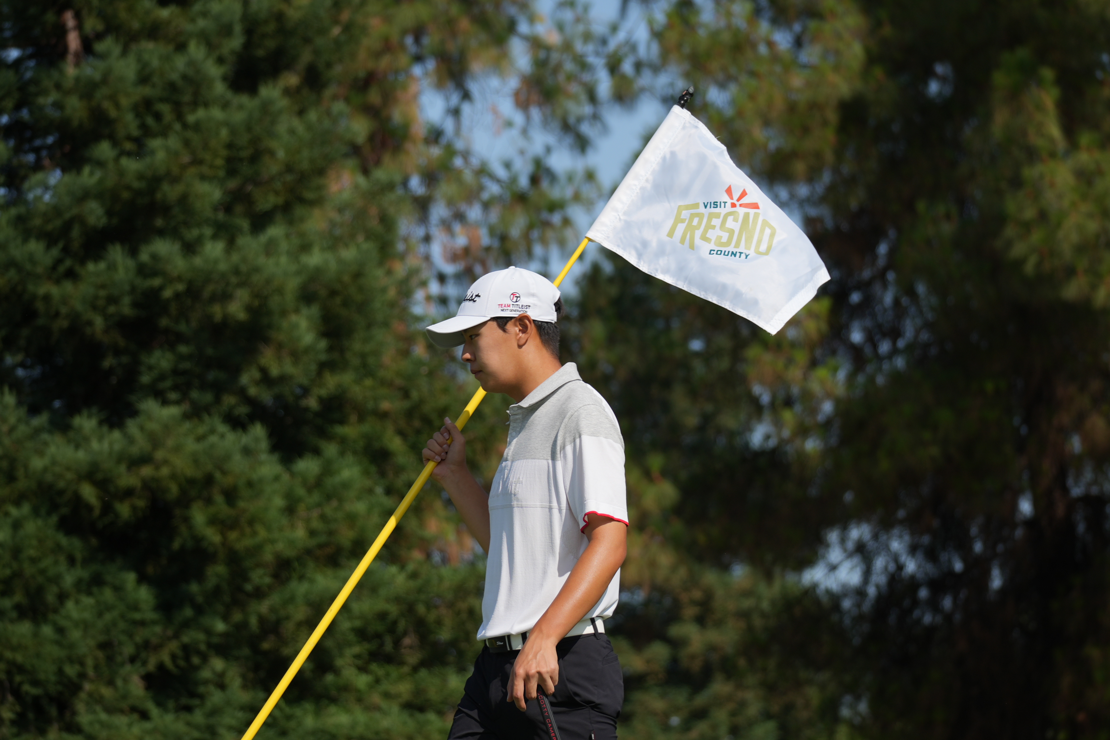Player holding Visit Fresno County flag - 2025 - Visit Fresno County Junior Championship (28).JPG