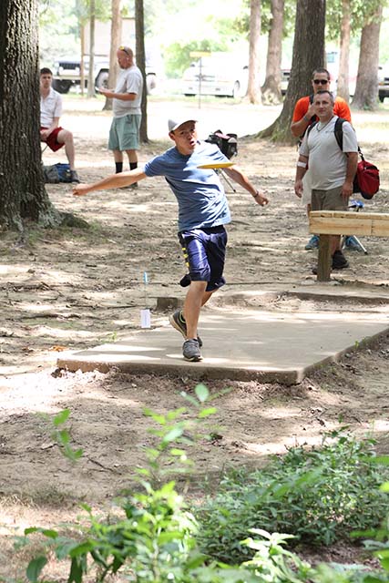 Blue shirt man, disc golf.JPG